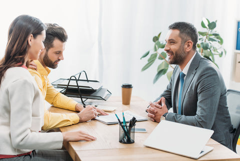 Business owners receiving business advisory services from Hall & Associates.